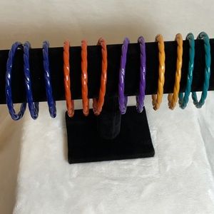 Vintage plastic bangle bracelets. Set of 12. Various colors.